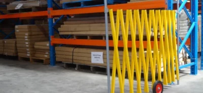 Portable barrier in use in a warehouse