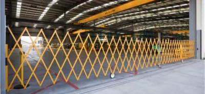 A wall-mounted safety barrier at the entrance of a workshop